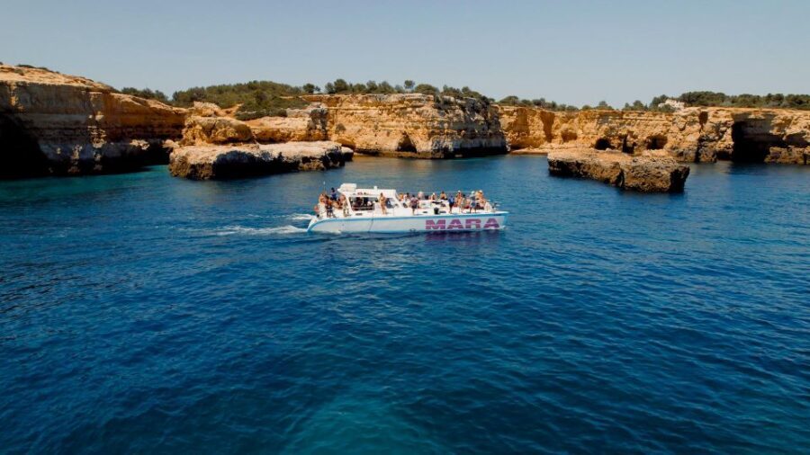Albufeira: Caves and Coastline Catamaran Cruise to Benagil - Albandeira Natural Arch and Praia da Marinha: sailing under dramatic walls