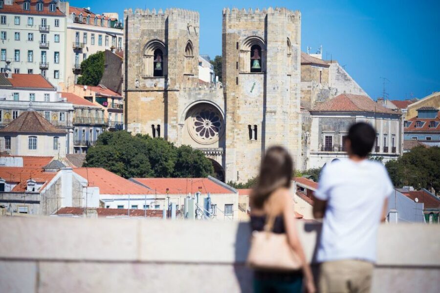 Best of Lisbon Walking Tour: Rossio, Chiado & Alfama - Alfama: wine, food, Fado atmosphere, and the logic of tiled facades