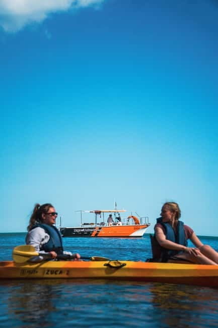 From Lagos: Ponta da Piedade Caves Kayak Tour from Catamaran - The boat-to-kayak slide and the 1.15-hour guided paddle