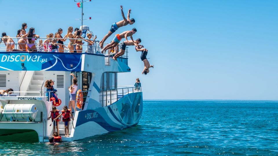 Lagos: Dolphins & Caves - Catamaran - The swim stop: a secluded bay, jumps, and the water slide