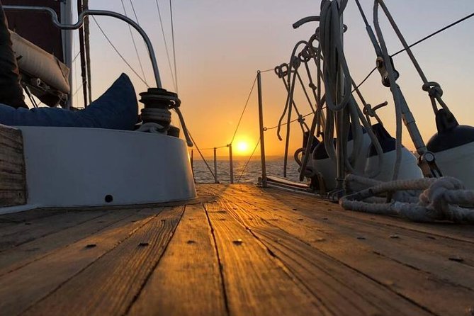 Lisbon: Daylight or Sunset on a Vintage Sailboat - Christ the King and the Bridge Lines Over a Two-Hour Loop