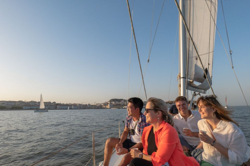 Lisbon: Daytime/Sunset/Night City Sailboat Tour with Drink - Under the 25 de Abril Bridge: the signature moment