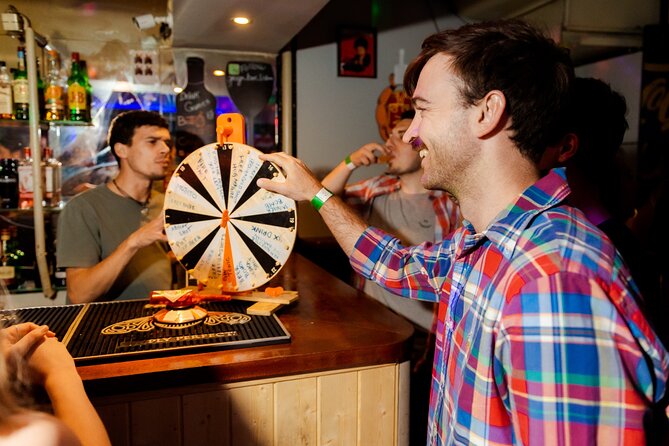 Lisbon: Pub Crawl with Open Bar, Shots & VIP Club Entry - Stop 2: Bairro Alto First Shot and Ice-Melting Energy