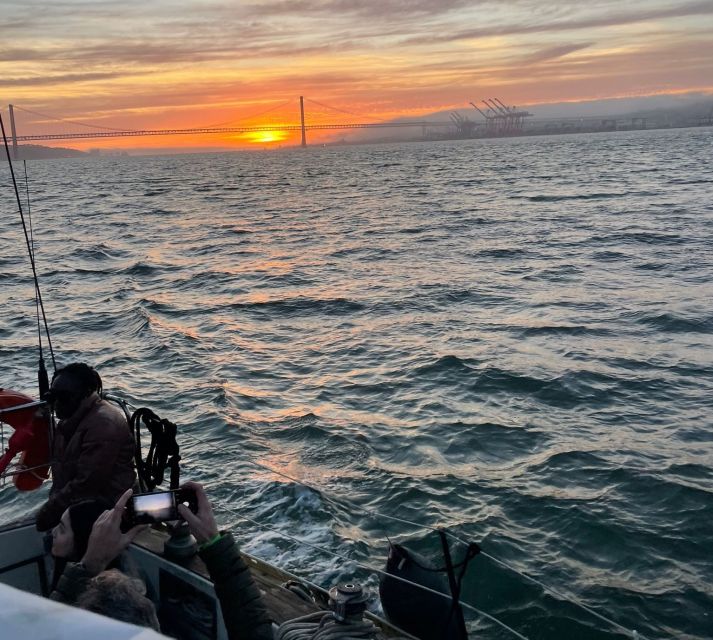 Lisbon: Sailboat Sunset Tour with a Drink - The crew magic: guides, captions, and moments you remember later