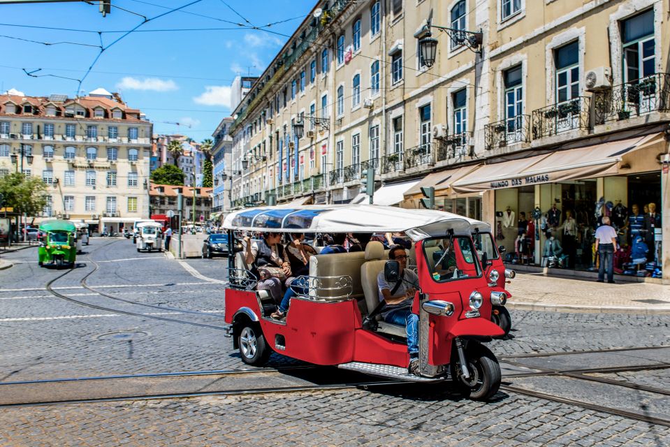 Porto: Guided Tour by Tuk-Tuk & Optional Douro River Cruise - Stock Market Palace, Miragaia, and the move toward the river